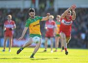 20 April 2024; Ryan McHugh of Donegal in action against Ciaran McFaul of Derry during the Ulster GAA Football Senior Championship quarter-final match between Derry and Donegal at Celtic Park in Derry. Photo by Stephen McCarthy/Sportsfile