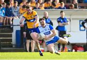 20 April 2024; Donie Fitzgerald of Waterford is tackled by Darragh Bohannon of Clare during the Munster GAA Football Senior Championship semi-final match between Waterford and Clare at Fraher Field in Dungarvan, Waterford. Photo by Tyler Miller/Sportsfile