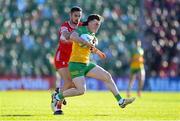 20 April 2024; Niall O'Donnell of Donegal in action against Christopher McKaigue of Derry during the Ulster GAA Football Senior Championship quarter-final match between Derry and Donegal at Celtic Park in Derry. Photo by Stephen McCarthy/Sportsfile