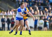 20 April 2024; James Power of Waterford in action against Ciarán Downes of Clare during the Munster GAA Football Senior Championship semi-final match between Waterford and Clare at Fraher Field in Dungarvan, Waterford. Photo by Tyler Miller/Sportsfile