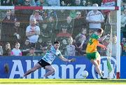 20 April 2024; Oisin Gallen of Donegal scores his side's third goal, a penalty, past Derry goalkeeper Odhran Lynch during the Ulster GAA Football Senior Championship quarter-final match between Derry and Donegal at Celtic Park in Derry. Photo by Stephen McCarthy/Sportsfile