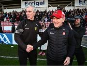 20 April 2024; Donegal manager Jim McGuinness, left, and Derry manager Mickey Harte shake hands after the Ulster GAA Football Senior Championship quarter-final match between Derry and Donegal at Celtic Park in Derry. Photo by Seb Daly/Sportsfile