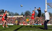 20 April 2024; Gareth McKinless of Derry in action against Donegal goalkeeper Shaun Patton during the Ulster GAA Football Senior Championship quarter-final match between Derry and Donegal at Celtic Park in Derry. Photo by Seb Daly/Sportsfile