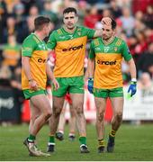 20 April 2024; Donegal players, from left, Peadar Mogan, Caolan McGonagle and Kevin McGettigan celebrate after the Ulster GAA Football Senior Championship quarter-final match between Derry and Donegal at Celtic Park in Derry. Photo by Stephen McCarthy/Sportsfile