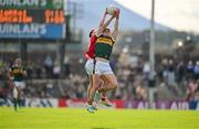 20 April 2024; Sean O'Shea of Kerry fields a kickout ahead of Sean Meehan of Cork during the Munster GAA Football Senior Championship semi-final match between Kerry and Cork at Fitzgerald Stadium in Killarney, Kerry. Photo by Brendan Moran/Sportsfile