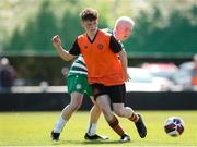 20 April 2024; Callum Doolan of St Kevin’s FC in action against Rhys Barry of Pike Rovers during the FAI Youth Cup final match between St Kevin’s FC, DDSL, and Pike Rovers, Limerick District League at Home Farm FC in Dublin. Photo by Michael P Ryan/Sportsfile