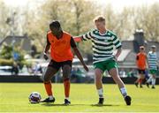 20 April 2024; Thalaga Segoapa of St Kevin’s FC in action against Jamie Mitchell of Pike Rovers during the FAI Youth Cup final match between St Kevin’s FC, DDSL, and Pike Rovers, Limerick District League at Home Farm FC in Dublin. Photo by Michael P Ryan/Sportsfile
