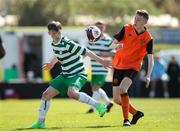20 April 2024; Dara McNamara of Pike Rovers in action against Evan McGee of St Kevin’s FC during the FAI Youth Cup final match between St Kevin’s FC, DDSL, and Pike Rovers, Limerick District League at Home Farm FC in Dublin. Photo by Michael P Ryan/Sportsfile