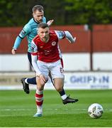 19 April 2024; Jamie Lennon of St Patrick's Athletic in action against Rowan McDonald of Waterford during the SSE Airtricity Men's Premier Division match between St Patrick's Athletic and Waterford at Richmond Park in Dublin. Photo by Piaras Ó Mídheach/Sportsfile