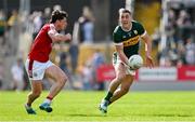 20 April 2024; Joe O'Connor of Kerry is tackled by Colm O'Callaghan of Cork during the Munster GAA Football Senior Championship semi-final match between Kerry and Cork at Fitzgerald Stadium in Killarney, Kerry. Photo by Brendan Moran/Sportsfile