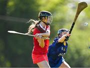 21 April 2024; Orlaith McElduff of Tyrone in action against Ciara Lambe of Wicklow during the Electric Ireland All-Ireland Camogie Minor C semi-final match between Tyrone and Wicklow at Dunganny in Meath. Photo by Sam Barnes/Sportsfile