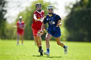 21 April 2024; Aishing O'Toole of Wicklow in action against Orlaith McElduff of Tyrone during the Electric Ireland All-Ireland Camogie Minor C semi-final match between Tyrone and Wicklow at Dunganny in Meath. Photo by Sam Barnes/Sportsfile