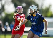21 April 2024; Aoife Molloy of Wicklow in action against Clara Doherty of Tyrone during the Electric Ireland All-Ireland Camogie Minor C semi-final match between Tyrone and Wicklow at Dunganny in Meath. Photo by Sam Barnes/Sportsfile