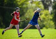21 April 2024; Ciara Connolly of Wicklow in action against Emer Cunningham of Tyrone during the Electric Ireland All-Ireland Camogie Minor C semi-final match between Tyrone and Wicklow at Dunganny in Meath. Photo by Sam Barnes/Sportsfile
