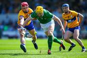 21 April 2024; Seamus Flanagan of Limerick is tackled by Diarmuid Ryan of Clare during the Munster GAA Hurling Senior Championship Round 1 match between Clare and Limerick at Cusack Park in Ennis, Clare. Photo by Ray McManus/Sportsfile
