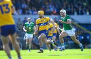 21 April 2024; Mark Rodgers of Clare in action against Kyle Hayes of Limerick during the Munster GAA Hurling Senior Championship Round 1 match between Clare and Limerick at Cusack Park in Ennis, Clare. Photo by John Sheridan/Sportsfile