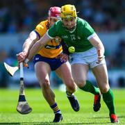 21 April 2024; Seamus Flanagan of Limerick is tackled by John Conlon of Clare during the Munster GAA Hurling Senior Championship Round 1 match between Clare and Limerick at Cusack Park in Ennis, Clare. Photo by Ray McManus/Sportsfile