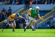21 April 2024; Aaron Gillane of Limerick races clear of Rory Hayes of Clare during the Munster GAA Hurling Senior Championship Round 1 match between Clare and Limerick at Cusack Park in Ennis, Clare. Photo by Ray McManus/Sportsfile