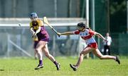 21 April 2024; Róisín McGonigle of Wexford in action against Éabha McElhinney of Derry during the Electric Ireland All-Ireland Camogie Minor A Shield semi-final match between Derry and Wexford at Clane in Kildare. Photo by Daire Brennan/Sportsfile