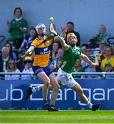 21 April 2024; Tom Morrissey of Limerick is tackled by Diarmuid Ryan of Clare during the Munster GAA Hurling Senior Championship Round 1 match between Clare and Limerick at Cusack Park in Ennis, Clare. Photo by Ray McManus/Sportsfile