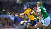 21 April 2024; Shane O'Donnell of Clare is tackled by Barry Nash  of Limerick during the Munster GAA Hurling Senior Championship Round 1 match between Clare and Limerick at Cusack Park in Ennis, Clare. Photo by John Sheridan/Sportsfile