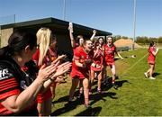 21 April 2024; Tyrone substitutes, including Hollie Croucher, 16, celebrate at the final whistle after their side's victory in the Electric Ireland All-Ireland Camogie Minor C semi-final match between Tyrone and Wicklow at Dunganny in Meath. Photo by Sam Barnes/Sportsfile