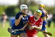 21 April 2024; Kila Kenny of Wicklow in action against Eva Cullen of Tyrone during the Electric Ireland All-Ireland Camogie Minor C semi-final match between Tyrone and Wicklow at Dunganny in Meath. Photo by Sam Barnes/Sportsfile