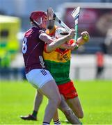21 April 2024; Chris Nolan of Carlow in action against Ronan Glennon of Galway during the Leinster GAA Hurling Senior Championship Round 1 match between Galway and Carlow at Pearse Stadium in Galway. Photo by Ray Ryan/Sportsfile