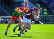 21 April 2024; Adrian Tuohey of Galway in action against Ciaran Whelan of Carlow during the Leinster GAA Hurling Senior Championship Round 1 match between Galway and Carlow at Pearse Stadium in Galway. Photo by Ray Ryan/Sportsfile