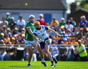 21 April 2024; Clare goalkeeper Eibhear Quilligan is tackled by Aaron Gillane of Limerick during the Munster GAA Hurling Senior Championship Round 1 match between Clare and Limerick at Cusack Park in Ennis, Clare. Photo by Ray McManus/Sportsfile