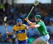 21 April 2024; Shane O'Donnell of Clare is tackled by Will O Donoghue  of Limerick during the Munster GAA Hurling Senior Championship Round 1 match between Clare and Limerick at Cusack Park in Ennis, Clare. Photo by Ray McManus/Sportsfile