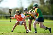 21 April 2024; Ríonagh Lenaghan of Armagh in action against India Mernagh of Carlow,  centre, and Carlow goalkeeper Aoibhinn Dowling, right, during the Electric Ireland All-Ireland Camogie Minor B semi-final match between Armagh and Carlow at Dunganny in Meath. Photo by Sam Barnes/Sportsfile