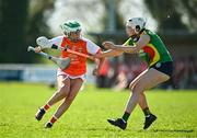 21 April 2024; Molly Short of Armagh in action against Niamh Tracey of Carlow during the Electric Ireland All-Ireland Camogie Minor B semi-final match between Armagh and Carlow at Dunganny in Meath. Photo by Sam Barnes/Sportsfile