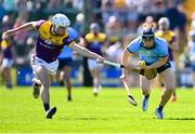 21 April 2024; Seán Currie of Dublin in action against Niall Murphy of Wexford during the Leinster GAA Hurling Senior Championship Round 1 match between Wexford and Dublin at Chadwicks Wexford Park in Wexford. Photo by Tyler Miller/Sportsfile