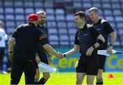 21 April 2024; Referee Sean Stack, right, shake hands with Carlow manager Tom Mullally before the Leinster GAA Hurling Senior Championship Round 1 match between Galway and Carlow at Pearse Stadium in Galway. Photo by Ray Ryan/Sportsfile