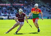 21 April 2024; Daithí Burke of Galway in action against Martin Kavanagh of Carlow during the Leinster GAA Hurling Senior Championship Round 1 match between Galway and Carlow at Pearse Stadium in Galway. Photo by Ray Ryan/Sportsfile