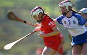 21 April 2024; Amy Sheppard of Cork is tackled by Hannah McGrath of Waterford during the Electric Ireland All-Ireland Camogie Minor A semi-final match between Cork and Waterford at Kilcommon in Tipperary. Photo by Tom Beary/Sportsfile