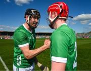 21 April 2024; Diarmaid Byrnes, left, and Donnacha Ó Dalaigh of Limerick celebrate after the Munster GAA Hurling Senior Championship Round 1 match between Clare and Limerick at Cusack Park in Ennis, Clare. Photo by Ray McManus/Sportsfile