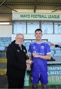 21 April 2024; Luke Walsh of Waterford & District Junior Football League is presented with the player of the match award by FAI Director of Competitions Fran Gavin after during the FAI Oscar Traynor Inter-League Cup final match between Mayo Football League and Waterford & District Junior League at Umbro Park, Milebush, Castlebar in Mayo. Photo by Michael P Ryan/Sportsfile