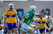 21 April 2024; Aaron Gillane of Limerick celebrates after scoring his side's third goal as Conor Cleary of Clare looks on during the Munster GAA Hurling Senior Championship Round 1 match between Clare and Limerick at Cusack Park in Ennis, Clare. Photo by John Sheridan/Sportsfile