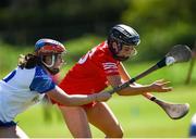 21 April 2024; Lucy O'Connell of Cork is tackled by Katie O'Neill of Waterford during the Electric Ireland All-Ireland Camogie Minor A semi-final match between Cork and Waterford at Kilcommon in Tipperary. Photo by Tom Beary/Sportsfile