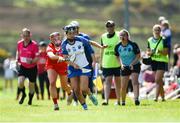 21 April 2024; Maggie Gostl of Waterford is tackled by Amy McCarthy of Cork during the Electric Ireland All-Ireland Camogie Minor A semi-final match between Cork and Waterford at Kilcommon in Tipperary. Photo by Tom Beary/Sportsfile
