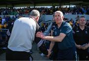 21 April 2024; The Clare and Limerick managers, Brian Lohan and John Keily, shake hands after the Munster GAA Hurling Senior Championship Round 1 match between Clare and Limerick at Cusack Park in Ennis, Clare. Photo by Ray McManus/Sportsfile