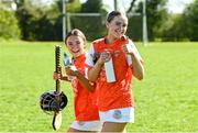 21 April 2024; Caoimhe Hart, right, and Mae Lavery of Armagh celebrate after their side's victory in the Electric Ireland All-Ireland Camogie Minor B semi-final match between Armagh and Carlow at Dunganny in Meath. Photo by Sam Barnes/Sportsfile