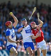 21 April 2024; Tadhg de Burca of Waterford gathers ahead of teammate Conor Prunty and Alan Connolly of Cork during the Munster GAA Hurling Senior Championship Round 1 match between Waterford and Cork at Walsh Park in Waterford. Photo by Brendan Moran/Sportsfile