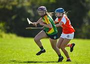 21 April 2024; Niamh Cox of Carlow in action against Laoise McConnell of Armagh during the Electric Ireland All-Ireland Camogie Minor B semi-final match between Armagh and Carlow at Dunganny in Meath. Photo by Sam Barnes/Sportsfile