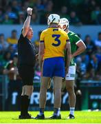 21 April 2024; Referee Colm Lyons issues yellow cards to Conor Cleary of Clare, left and Aaron Gillane of Limerick during the Munster GAA Hurling Senior Championship Round 1 match between Clare and Limerick at Cusack Park in Ennis, Clare. Photo by John Sheridan/Sportsfile