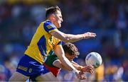 21 April 2024; Diarmuid Murtagh of Roscommon in action against Jordan Flynn of Mayo during the Connacht GAA Football Senior Championship semi-final match between Roscommon and Mayo at Dr Hyde Park in Roscommon. Photo by Piaras Ó Mídheach/Sportsfile