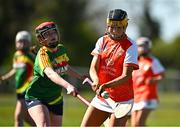 21 April 2024; Caitlin Byrne of Armagh in action against Molly Kavanagh of Carlow during the Electric Ireland All-Ireland Camogie Minor B semi-final match between Armagh and Carlow at Dunganny in Meath. Photo by Sam Barnes/Sportsfile