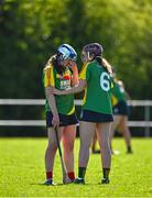 21 April 2024; Carlow players, including Clodagh Lawler, left, and Niamh Cox, 6, dejected after their side's defeat in the Electric Ireland All-Ireland Camogie Minor B semi-final match between Armagh and Carlow at Dunganny in Meath. Photo by Sam Barnes/Sportsfile